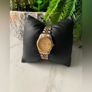 Vintage Benrus diamond Quartz watch in gold tone.